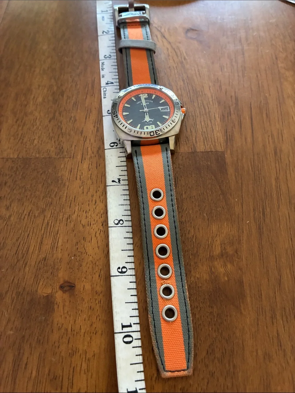 Tommy BAHAMA Orange and Gray Sport Watch with Canvas Strap. Water resistant